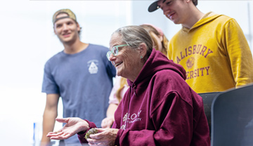 student and instructor in front of anatomy screen